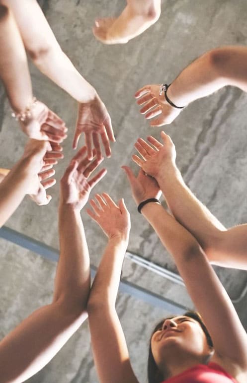 Team happy, hands in air