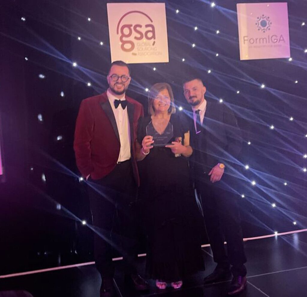 Three SSCL colleagues at gsa awards 2024 holding award.
